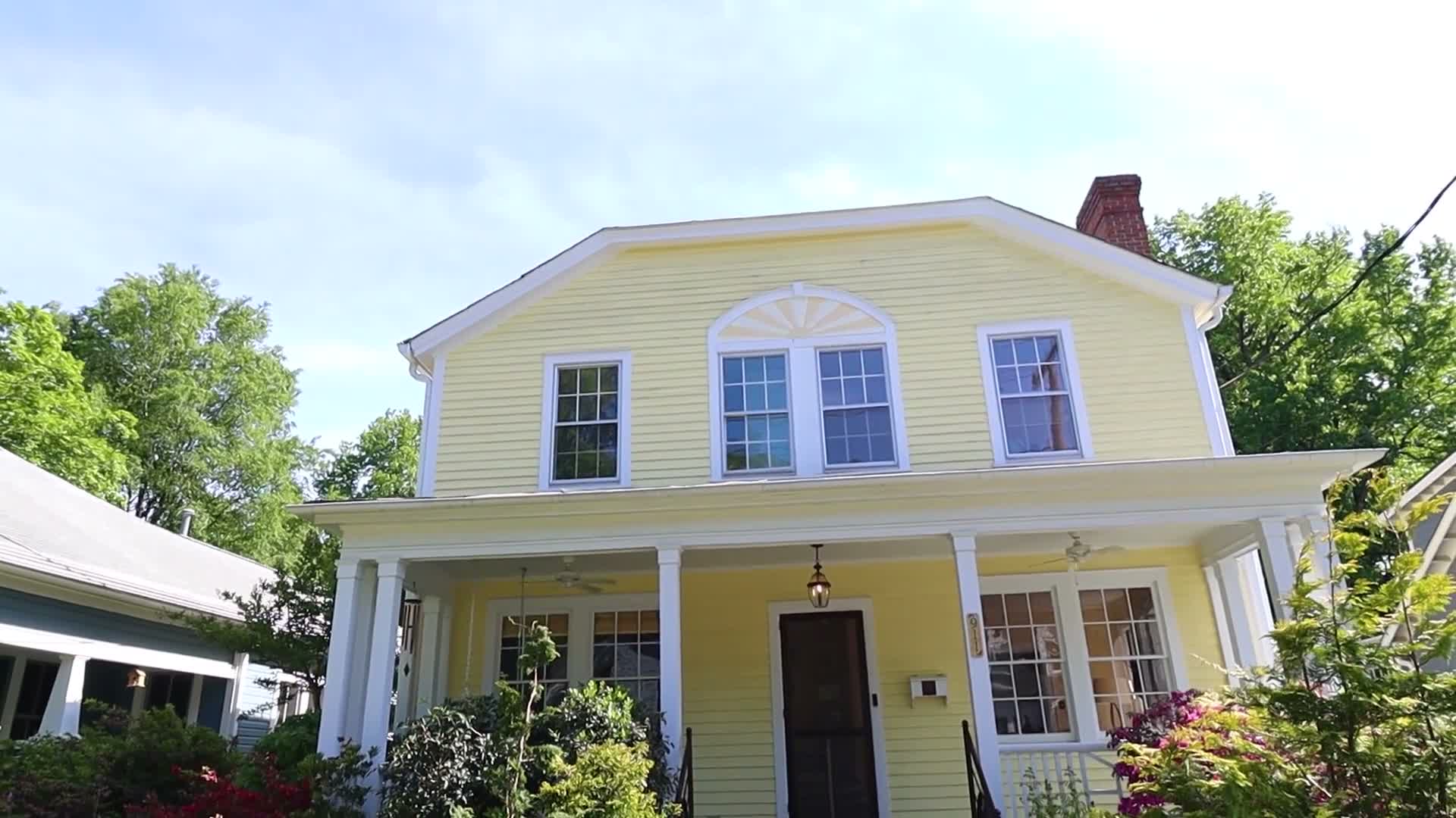 Covered porch on a yellow house
